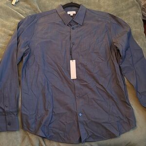 New and unworn Calvin Klein button down dress shirt size L in dark blue and grey